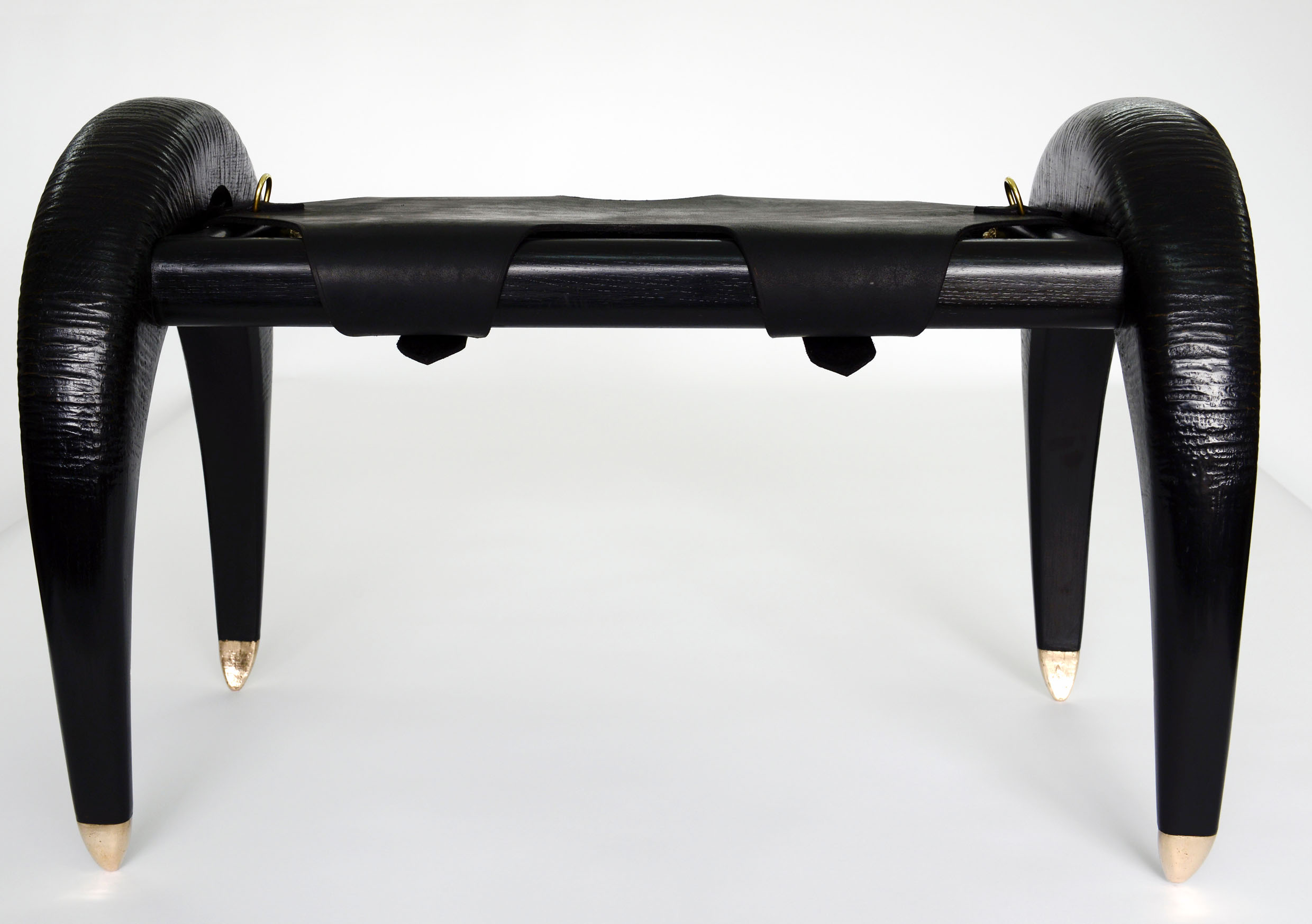 Hand carved from Oak, treated with a Black pigment based bio resin creating a moisture resilient tactile surface.  Embracing voluptuous curved legs resting on bronze stiletto tips, with four discreetly placed nipples cast form a Cornish Pixie in bronze. Erotic furniture Erotic lighting swallowandbone.com 
